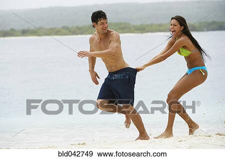 South American couple playing at beach View Large Photo Image Stock Photo - South American couple playing at beach. Fotosearch