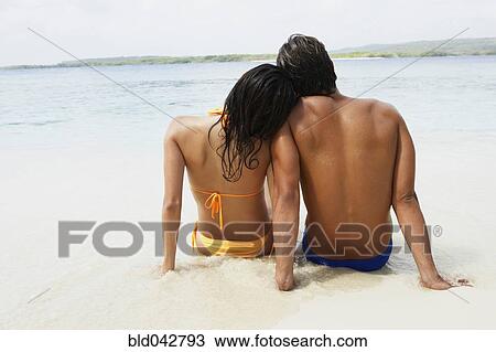 South American couple sitting on beach View Large Photo Image Stock Image - South American couple sitting on beach. Fotosearch