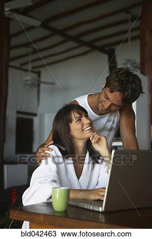 Stock Image - South American couple smiling at each other. Fotosearch
