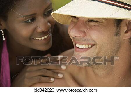 South American couple smiling at each other View Large Photo Image Stock Photograph - South American couple smiling at each other. Fotosearch