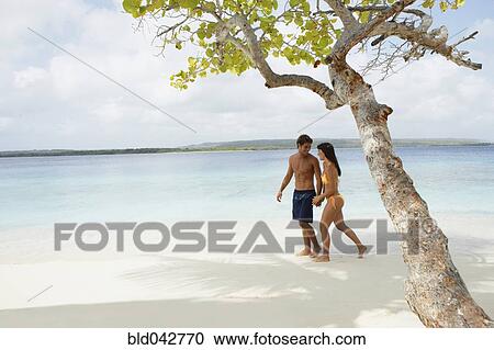 South American couple walking on beach View Large Photo Image Stock Image - South American couple walking on beach. Fotosearch