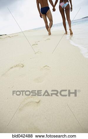 South American couple walking on beach View Large Photo Image Stock Photo - South American couple walking on beach. Fotosearch