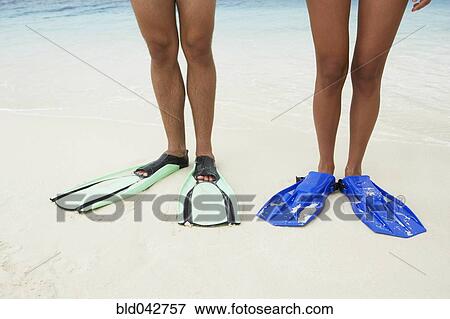 Stock Photo - South American couple wearing flippers. Fotosearch