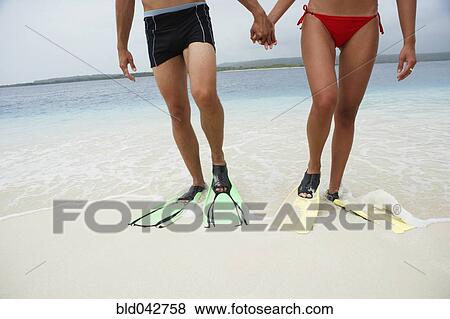 Stock Photo - South American couple wearing flippers. Fotosearch