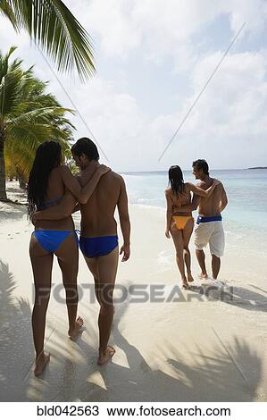 South American couples walking on beach View Large Photo Image Stock Image - South American couples walking on beach. Fotosearch