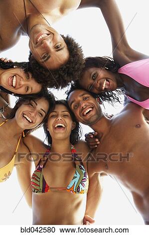 South American friends hugging at beach View Large Photo Image Stock Image - South American friends hugging at beach. Fotosearch