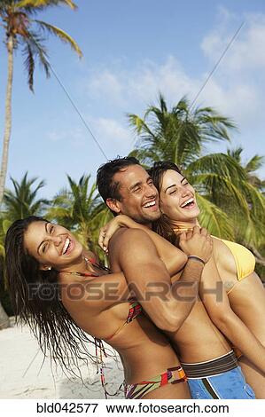 South American friends hugging at beach View Large Photo Image Stock Photo - South American friends hugging at beach. Fotosearch