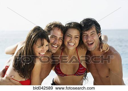 South American friends hugging at beach View Large Photo Image Stock Photo - South American friends hugging at beach. Fotosearch