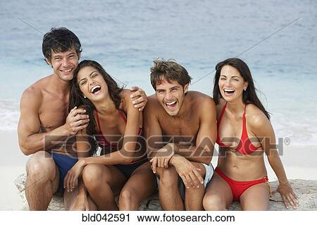 South American friends laughing at beach View Large Photo Image Stock Image - South American friends laughing at beach. Fotosearch