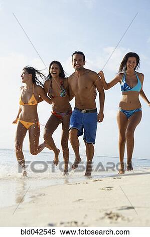 South American friends running at beach View Large Photo Image Stock Photography - South American friends running at beach. Fotosearch