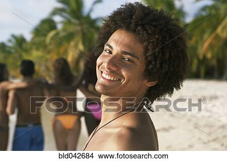 Picture - South American man at beach. Fotosearch