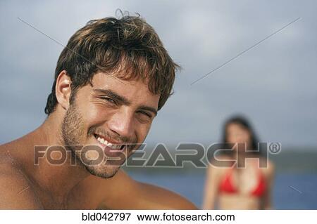 Stock Photo - South American man at beach. Fotosearch
