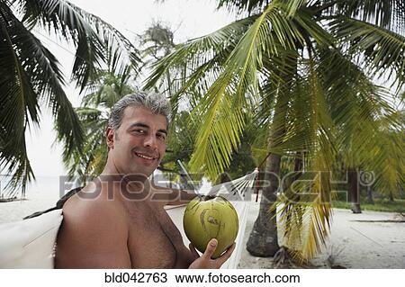 South American man drinking from coconut View Large Photo Image Stock Image - South American man drinking from coconut. Fotosearch