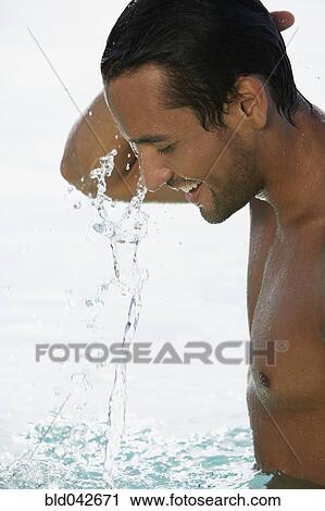 Stock Image - South American man in water. Fotosearch