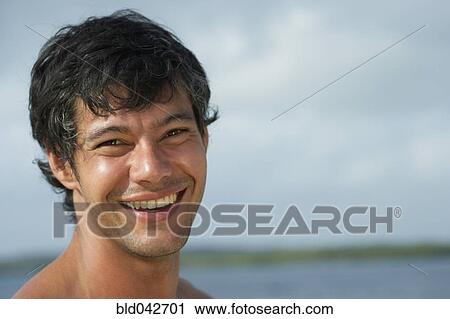 Stock Image - South American man laughing. Fotosearch