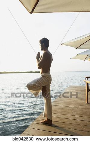 South American man practicing yoga View Large Photo Image Stock Image - South American man practicing yoga. Fotosearch
