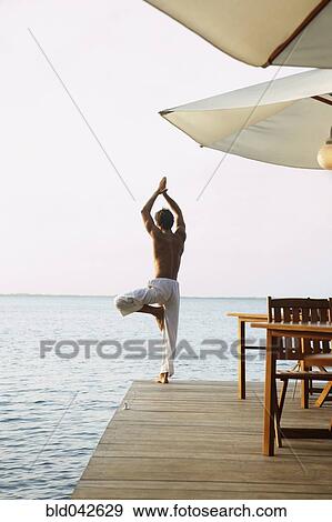 South American man practicing yoga View Large Photo Image Stock Photo - South American man practicing yoga. Fotosearch