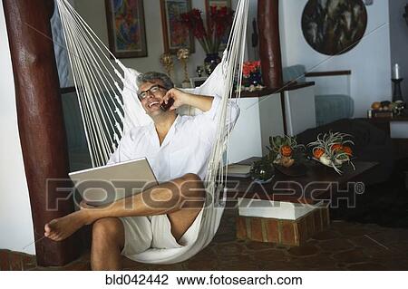 South American man talking on cell phone View Large Photo Image Stock Image - South American man talking on cell phone. Fotosearch
