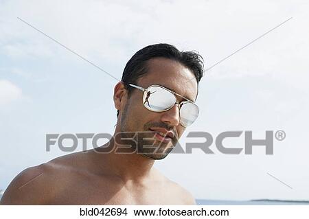Picture - South American man wearing sunglasses. Fotosearch