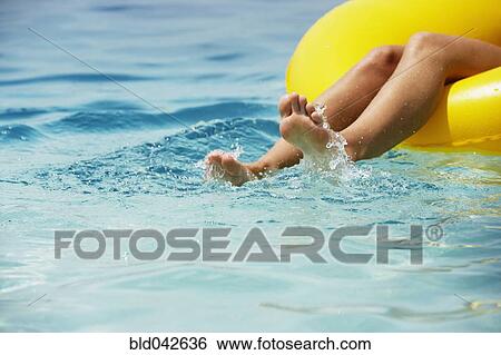 Stock Photograph - South American woman in raft. Fotosearch