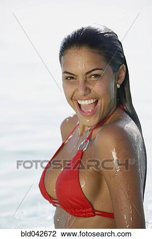 Stock Image - South American woman in water. Fotosearch