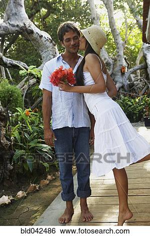 South American woman kissing boyfriend View Large Photo Image Stock Photograph - South American woman kissing boyfriend. Fotosearch