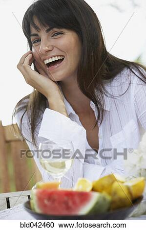 Stock Image - South American woman laughing. Fotosearch
