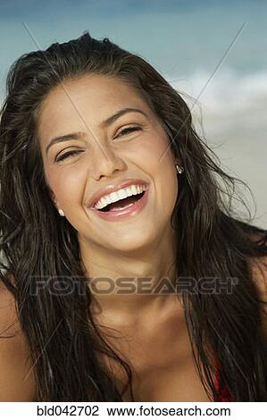 Stock Image - South American woman laughing. Fotosearch