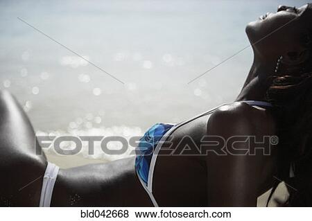 South American woman laying on beach View Large Photo Image Stock Photo - South American woman laying on beach. Fotosearch