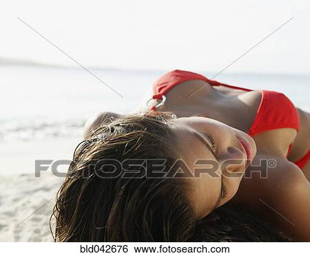 South American woman laying on beach View Large Photo Image Stock Photograph - South American woman laying on beach. Fotosearch