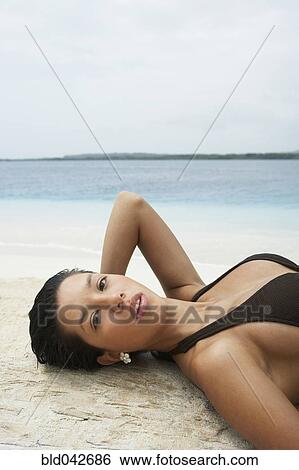 South American woman laying on beach View Large Photo Image Stock Photograph - South American woman laying on beach. Fotosearch