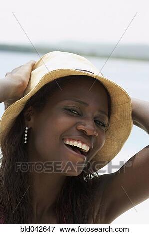Stock Photo - South American woman wearing hat. Fotosearch