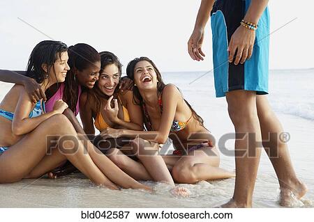 South American women laughing at beach View Large Photo Image Stock Photo - South American women laughing at beach. Fotosearch