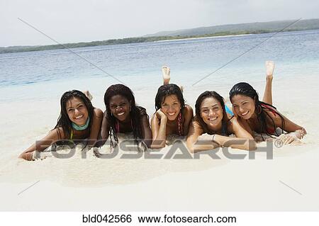 South American women laying on beach View Large Photo Image Stock Photograph - South American women laying on beach. Fotosearch