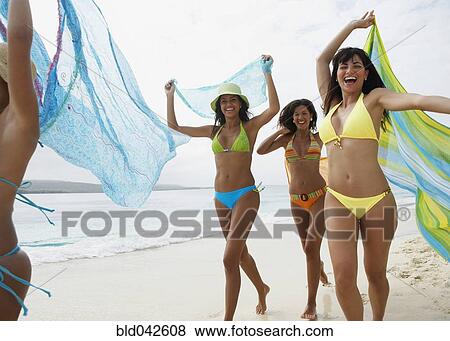South American women running on beach View Large Photo Image Stock Photo - South American women running on beach. Fotosearch