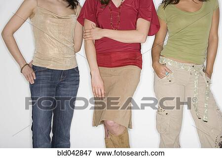 Studio shot of three young women View Large Photo Image Stock Photo - Studio shot of three young women. Fotosearch