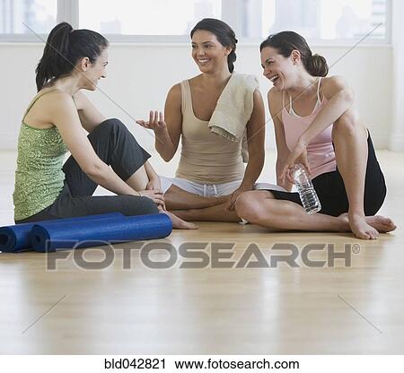 Three young women in yoga class View Large Photo Image Stock Image - Three young women in yoga class. Fotosearch