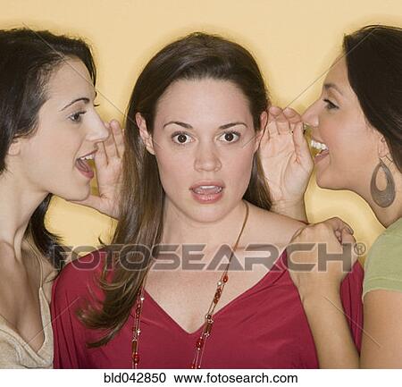 Women whispering secrets to friend View Large Photo Image Stock Image - Women whispering secrets to friend. Fotosearch
