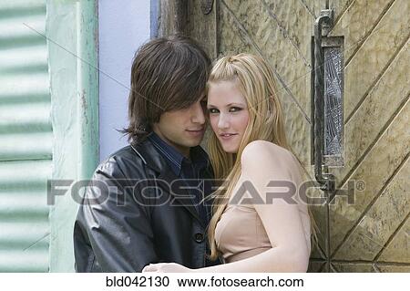 Stock Image - Young couple hugging. Fotosearch