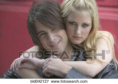 Stock Photo - Young couple hugging. Fotosearch