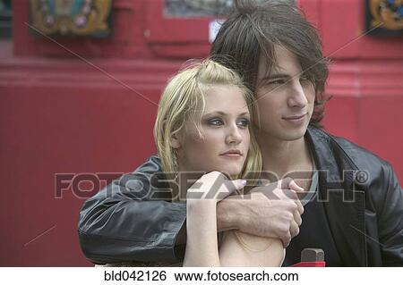 Stock Photograph - Young couple hugging. Fotosearch