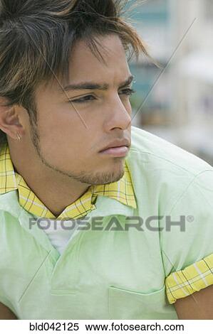 Young Hispanic man looking to side View Large Photo Image Stock Photography - Young Hispanic man looking to side. Fotosearch
