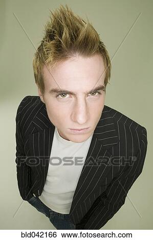Young man with spiked hair View Large Photo Image Stock Photograph - Young man with spiked hair. Fotosearch