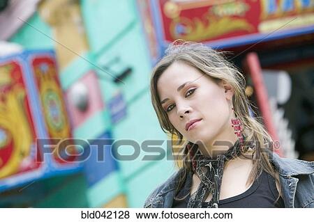 Stock Photo - Young woman wearing scarf. Fotosearch
