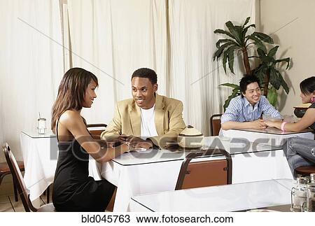 African American couple holding hands at table View Large Photo Image Stock Image - African American couple holding hands at table. Fotosearch