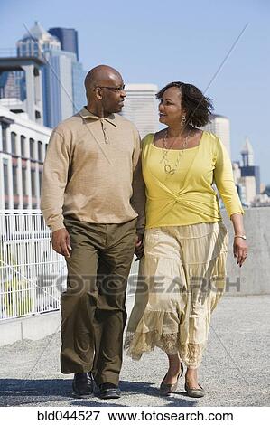 Stock Photo - African American couple holding hands. Fotosearch