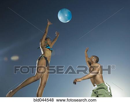 African American couple playing with beach ball View Large Photo Image Stock Photo - African American couple playing with beach ball. Fotosearch