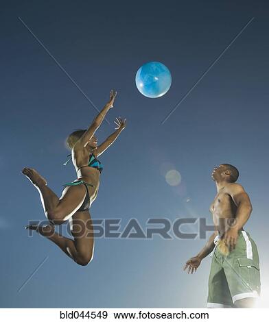 African American couple playing with beach ball View Large Photo Image Stock Photo - African American couple playing with beach ball. Fotosearch