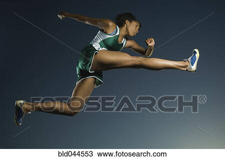 African American female athlete jumping View Large Photo Image Stock Image - African American female athlete jumping. Fotosearch