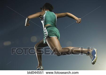 Stock Image - African American female athlete running. Fotosearch